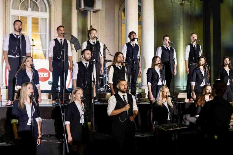 The Viva Vox Choir performing live on stage during the IMGL 2026 closing night at the White Palace